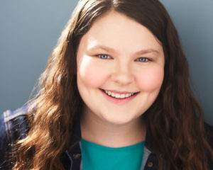 Headshot with turquoise shirt