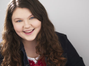 Headshot smiling with red shirt